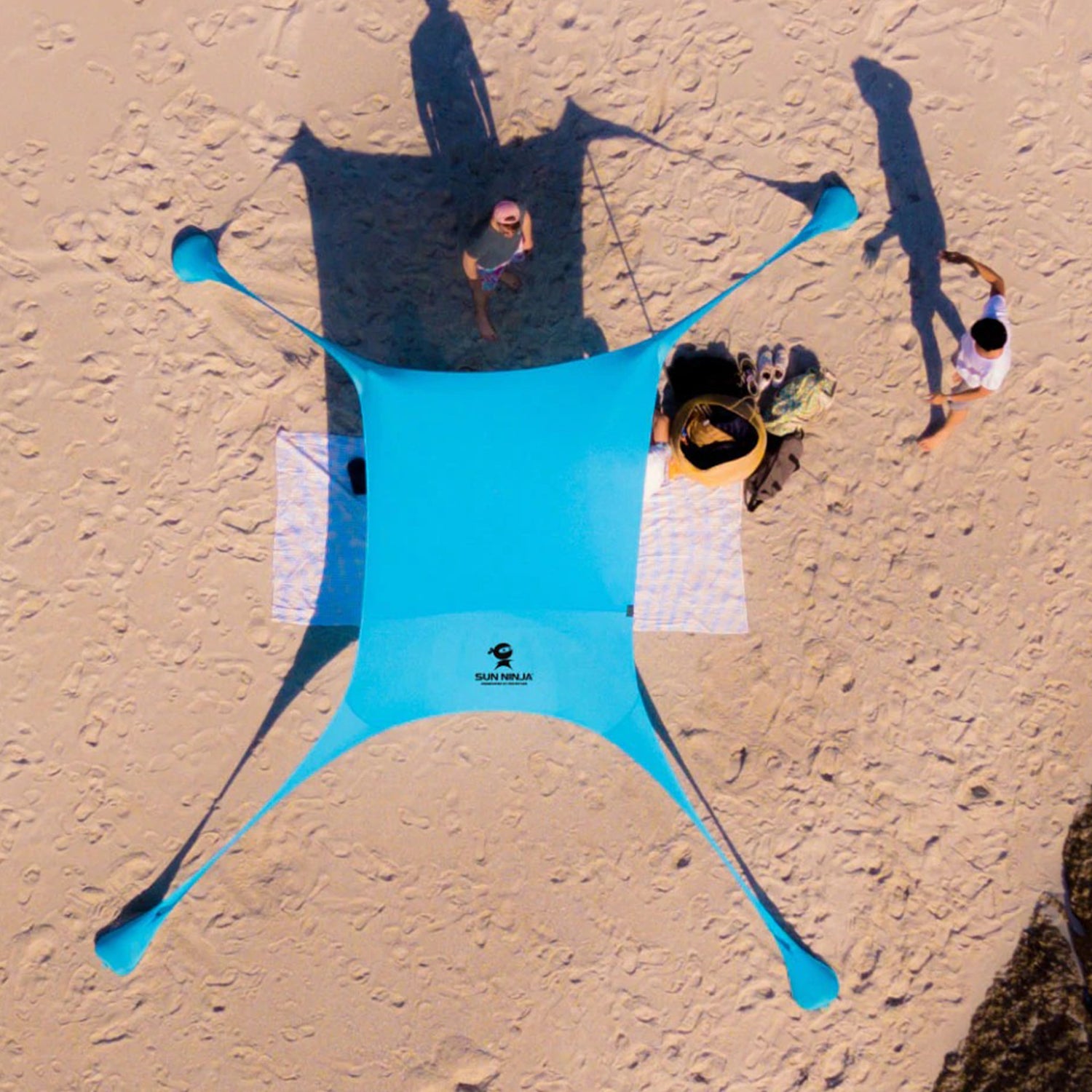 https://www.sunninja.com/cdn/shop/products/SunNinja_Product-Photo_Beach_Aerial.jpg?v=1651183891&width=1500